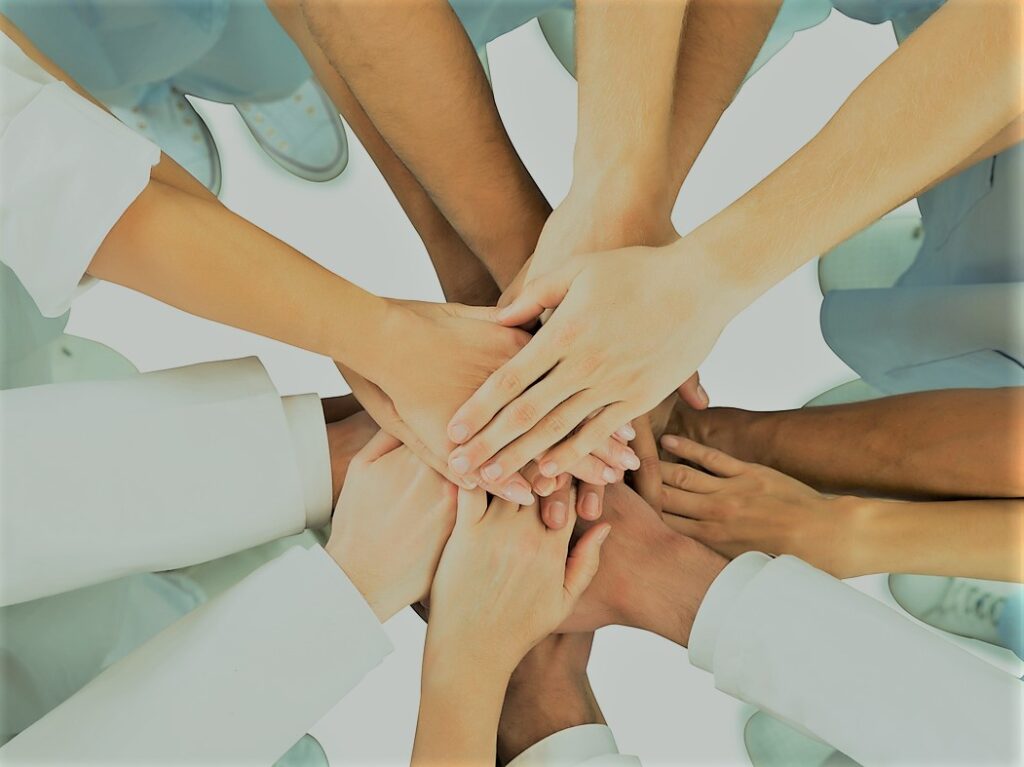 directly above shot of medical team standing hands