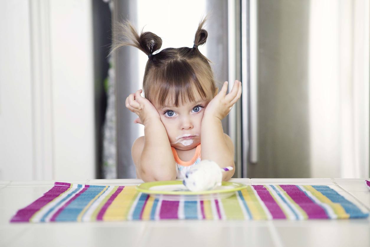 little girl is eating ice cream